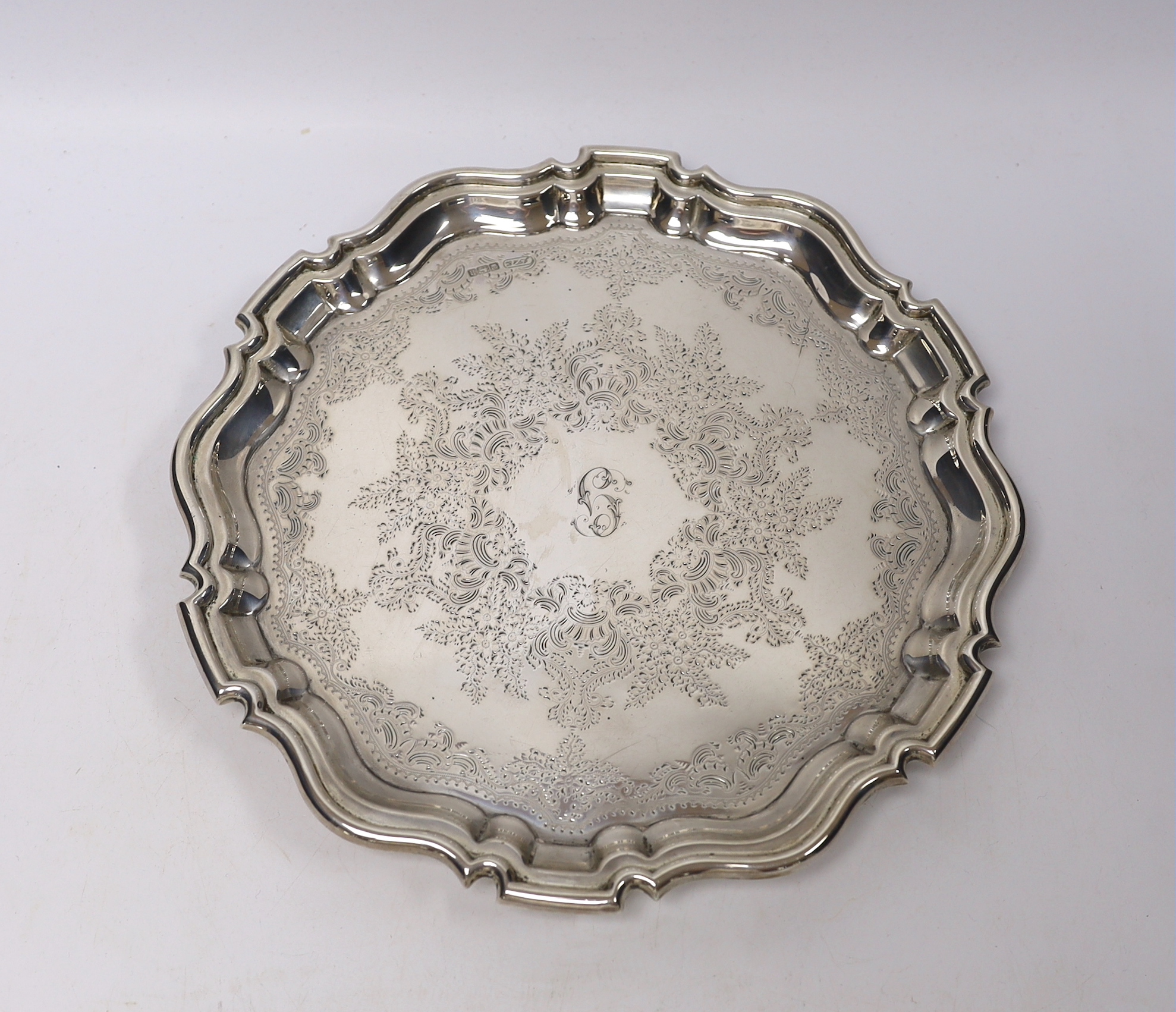 An Edwardian engraved silver salver, JT & Co?, Sheffield, 1905, on three scroll feet, 29.5cm